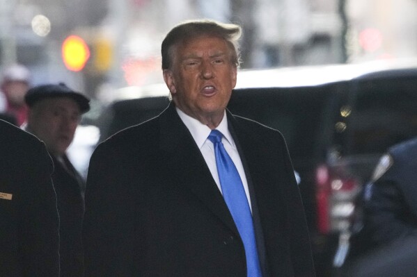 FILE - Former President Donald Trump leaves his apartment building in New York, Monday, Jan. 22, 2024. On Friday, Jan. 26, The Associated Press reported on stories circulating online incorrectly claiming a judge on Monday delayed proceedings in Trump’s New York defamation trial until Tuesday, the day of the New Hampshire primary, which is proof of election interference. (AP Photo/Seth Wenig, File)
