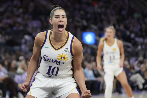 Los Angeles Sparks guard Kelsey Plum (10) celebrates after scoring against the Golden State Valkyries during the second half of a WNBA basketball game in San Francisco, Friday, May 16, 2025. (AP Photo/Jeff Chiu)