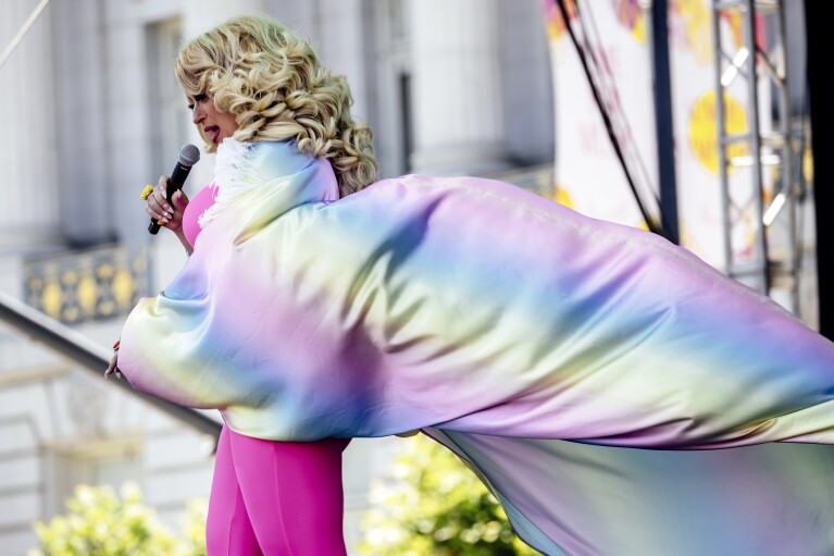 San Francisco Drag Laureate D'Arcy Drollinger speaks on stage during the first of two days of Pride Celebration at Civic Center in San Francisco, Saturday, June 29, 2024. (Stephen Lam/San Francisco Chronicle via AP)