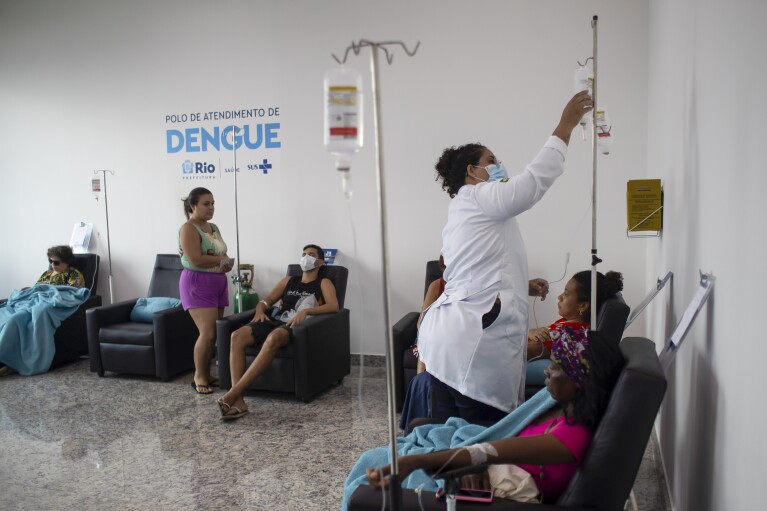 A nurse attends patients suspected of having dengue at the Carioca Health Super Center in Rio de Janeiro, Brazil, Friday, March 1, 2024. (AP Photo/Bruna Prado)