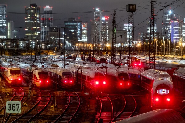 ICE trains are parked outside the central station in Frankfurt, Germany, Wednesday, Jan. 24, 2024. German train drivers' union GDL has called for a six-days lasting strike starting early Wednesday. (AP Photo/Michael Probst)