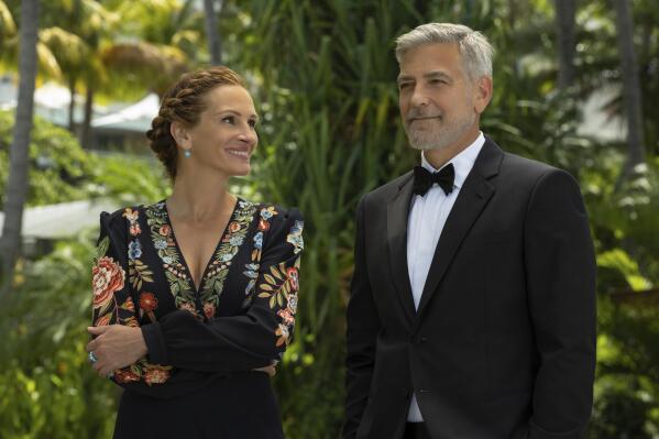 This image released by Universal Pictures shows George Clooney, right, and Julia Roberts in "Ticket to Paradise." (Vince Valitutti/Universal Pictures via AP)