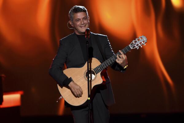 FILE - Alejandro Sanz performs "Mala Gente" at the Latin Recording Academy Person of the Year gala honoring Juanes on Nov. 13, 2019, in Las Vegas. Sanz performed "Imagine" by John Lennon and Yoko Ono, with John Legend, Keith Urban and Angelique Kidjo via pre-recorded video at the opening ceremony of the Tokyo Olympics on July 23, 2021. (Photo by Chris Pizzello/Invision/AP, File)