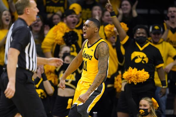 Iowa guard Tony Perkins (11) celebrates after making a basket during the first half of an NCAA college basketball game against Michigan State, Tuesday, Feb. 22, 2022, in Iowa City, Iowa. (AP Photo/Charlie Neibergall)