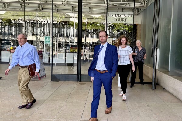 Stephen Tyler Bieneman walks out of a U.S. courthouse after the first day of his trial in Honolulu, Monday, Nov. 6, 2023. Bieneman has pleaded not guilty to assault after a woman accused of him assaulting her in Antarctica. (AP Photo/Jennifer Sinco Kelleher)