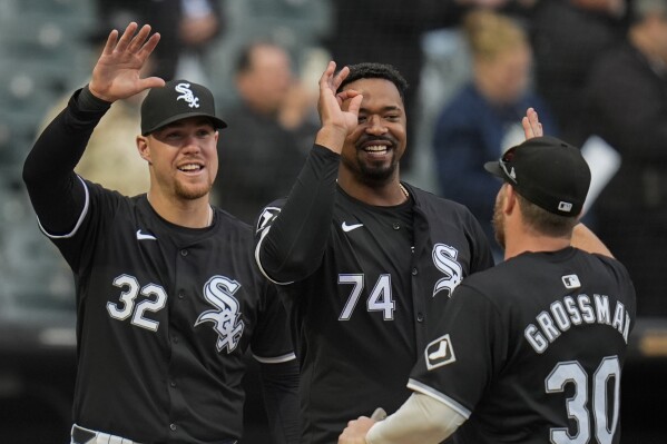 Chicago White Sox's Gavin Sheets, Eloy Jiménez and Robbie Grossman, from left, celebrate the team's win over the Kansas City Royals in the second baseball game of a doubleheader Wednesday, April 17, 2024, in Chicago. (AP Photo/Erin Hooley)