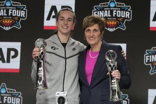 Indiana head coach Teri Moren posses with Iowa's Caitlin Clark at a press conference after both was introduced as the AP Coach of the Year and AP Player of the Year Thursday, March 30, 2023, in Dallas. (AP Photo/Darron Cummings)