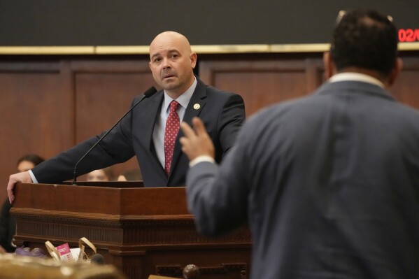 FILE - Mississippi Rep. Cedric Burnett, D-Tunica, right, asks a question of Mississippi House Gaming Committee Chairman Casey Eure, R-Saucier, regarding the Mississippi Mobile Sports Wagering Act, Feb. 1, 2024, during floor debate in the House of Representatives at the state Capitol in Jackson, Miss. Mobile sports betting will remain illegal in Mississippi after legislative negotiators failed to advance a final proposal Monday, April 29. (AP Photo/Rogelio V. Solis, File)