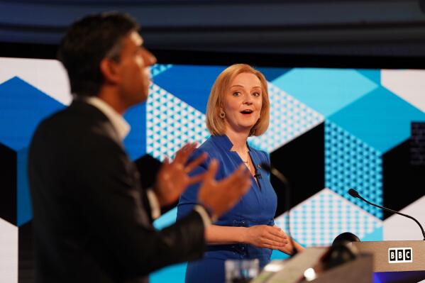 FILE - Liz Truss, right, and Rishi Sunak take part in the BBC Conservative Party leadership debate in Stoke-on-Trent, England, Monday July 25, 2022. Britain’s next prime minister will take office amid turmoil: galloping inflation, a war in Ukraine, souring relations with China and a changing climate. But not all those issues are getting equal attention as Foreign Secretary Truss and former Treasury chief Sunak vie for the votes of about 180,000 Conservative Party members. (Jacob King/Pool via AP, File)