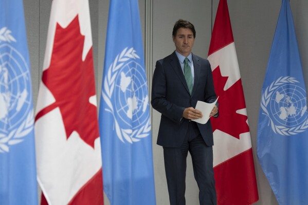 Prime Minister Justin Trudeau makes his way to the podium for a news conference at the Canadian Permanent Mission, in New York, Thursday, Sept. 21, 2023. (Adrian Wyld/The Canadian Press via AP)