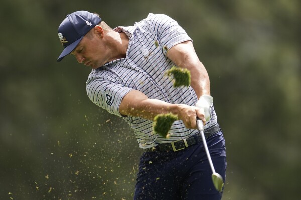 Bryson DeChambeau hits his tee shot on the fourth hole during the first round at the Masters golf tournament at Augusta National Golf Club Thursday, April 11, 2024, in Augusta, Ga. (AP Photo/George Walker IV)