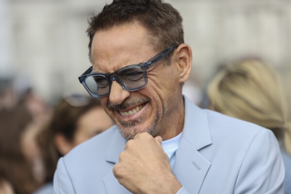 Robert Downey Jr. poses for photographers at the photo call for the film 'Oppenheimer' on Wednesday, July 12, 2023 in London. (Vianney Le Caer/Invision/AP)
