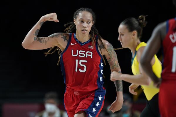 FILE - United States's Brittney Griner (15) flexes her muscle after making a basket during a women's basketball quarterfinal round game against Australia at the 2020 Summer Olympics, Wednesday, Aug. 4, 2021, in Saitama, Japan. The United States stepped up its push Friday, March 18, 2022, for consular access to Brittney Griner, the WNBA star who is detained in Russia on allegations of drug smuggling, as a member of a Russian state-backed prison monitoring group said Griner was faring well behind bars. (AP Photo/Charlie Neibergall, File)