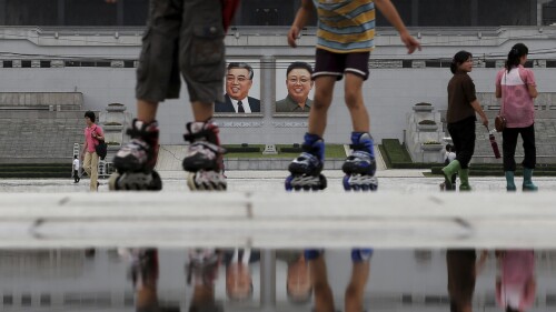 FILE - Children skate around Kim Il Sung Square on Sunday, July 21, 2013, in downtown Pyongyang, North Korea.  With a US soldier crossing the border from North Korea in the border town of Panmunjom on Tuesday, July 18, 2023, and in custody this week, talks turn to the nation itself - a country known for its distrust of foreigners but also rejects frequent descriptions of it as reclusive.  (AP Photo/Wong Maye-E, File)