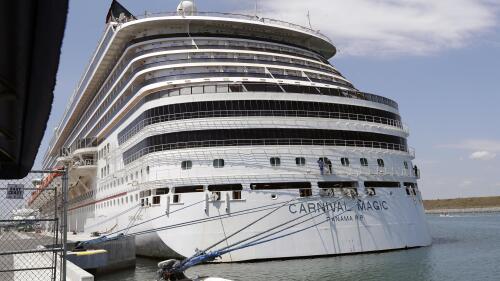 FILE - The Carnival cruise line ship Carnival Magic sits docked on April, 2020, in Cape Canaveral, Fla. The U.S. Coast Guard said Tuesday, May 30, 2023, that it's searching for a man who fell from a cruise ship off the coast of Florida. The 35-year-old was on the Carnival Magic when he fell from the ship about 186 miles east of Jacksonville, Fla., on Monday, May 29. (AP Photo/John Raoux, File)