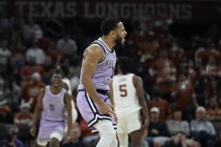 Kansas State guard Markquis Nowell (1) reacts after scoring against Texas during the second half of an NCAA college basketball game in Austin, Texas, Tuesday, Jan. 3, 2023. (AP Photo/Eric Gay)