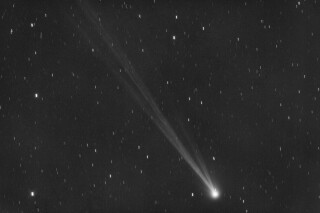 This image provided by Gianluca Masi shows the comet C/2023 P1 Nishimura and its tail seen from Manciano, Italy on Sept. 5, 2023. Stargazers across the Northern Hemisphere should catch a glimpse as soon as possible because it will be another 400 years before the wandering ice ball returns. (Gianluca Masi via AP)
