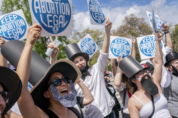 FILE - Protesters dressed as Abraham Lincoln chant during a Planned Parenthood rally in support of abortion access outside the U.S. Supreme Court, April 15, 2023, in Washington. A new poll from from AAPI Data and The Associated Press-NORC Center for Public Affairs Research shows that Asian Americans, Native Hawaiians and Pacific Islanders in the U.S. are highly supportive of legal abortion, even in situations where the pregnant person wants an abortion for any reason. (AP Photo/Nathan Howard, File)