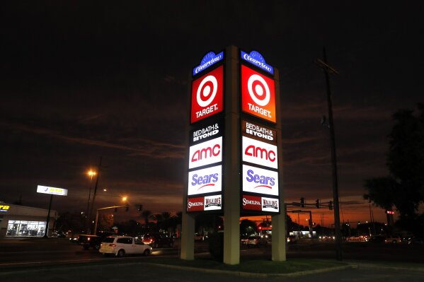 FILE - This Aug. 15, 2019, file photo shows signage for Target, Bed Bath & Beyond, AMC Theaters, and Sears in Metairie, La. Nine months out of bankruptcy, Sears is limping into the holiday shopping season. (AP Photo/Gerald Herbert)