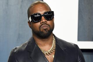 FILE - Kanye West arrives at the Vanity Fair Oscar Party on Feb. 9, 2020, in Beverly Hills, Calif. The rapper formerly known as Kanye West is offering to buy right-wing friendly social network Parler after being booted off of Twitter and Instagram. (Photo by Evan Agostini/Invision/AP, File)