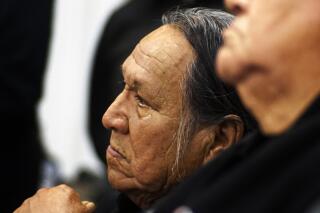 FILE - In this Dec. 5, 2016, file photo, Chief Leonard Crow Dog listens during an orientation at Sitting Bull College in Cannon Ball, North Dakota. Crow Dog, 78, died Sunday, June 6, 2021, at his home at Crow Dog's Paradise on the Rosebud Indian Reservation in South Dakota. The renowned Lakota spiritual leader and activist fought for tribal sovereignty, language preservation, religious freedom and traditional ways of life.(Richard Tsong-Taatarii/Star Tribune via AP, File)