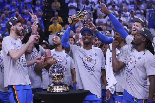 Oklahoma City Thunder guard Shai Gilgeous-Alexander (2), middle, celebrates with teammates after Game 5 of the Western Conference finals of the NBA basketball playoffs against the Minnesota Timberwolves, Wednesday, May 28, 2025, in Oklahoma City. (AP Photo/Nate Billings)