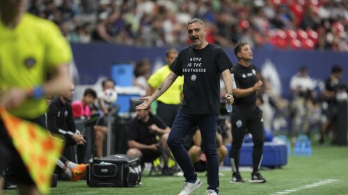 Vancouver Whitecaps coach Vanni Sartini reacts on the sideline during the second half of the team's MLS soccer match against Austin FC on Wednesday, July 12, 2023, in Vancouver, British Columbia. (Darryl Dyck/The Canadian Press via AP)