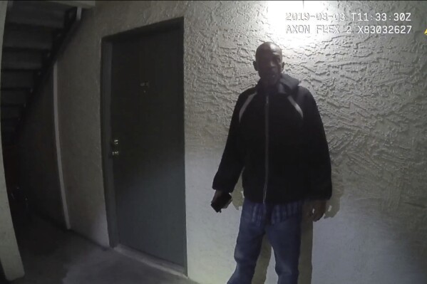 This image from Las Vegas Metropolitan Police Department body-camera video shows Roy Scott, 65, outside his apartment complex in Las Vegas on March 3, 2019, moments after he tells police officers that he is a paranoid schizophrenic. Scott is one of at least 12 people who died in Nevada from 2012 through 2021 during or shortly after encounters with police that did not involve a gun, an investigation by The Associated Press and the Howard Center for Investigative Journalism at Arizona State University found. (Las Vegas Metropolitan Police Department, via Howard Center for Investigative Journalism via AP)