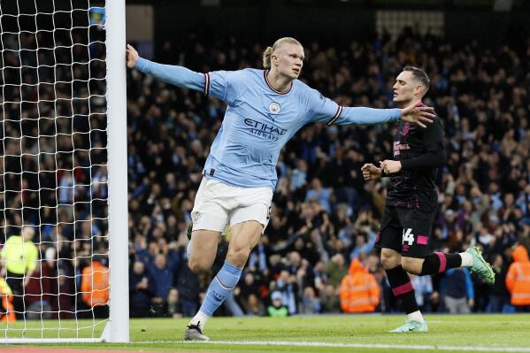 Manchester City's Erling Haaland celebrates scoring his side's first goal of the game during the FA Cup quarterfinal soccer match at the Etihad Stadium, Manchester, England, Saturday March 18, 2023. (Richard Sellers/PA via AP)
