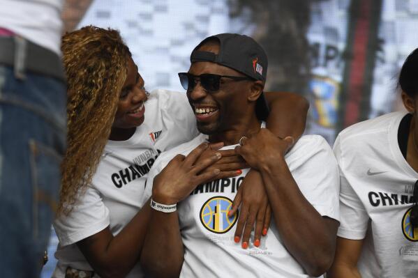Chicago Sky head coach James Wade, center, celebrates with teammates during their 2021 WNBA Championship rally at Millennium Park on Tuesday, Oct. 19, 2021, in Chicago. (AP Photo/Matt Marton)