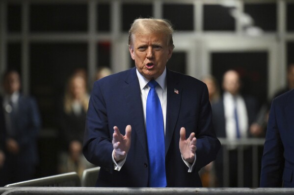 Former U.S. President and Republican presidential candidate Donald Trump speaks to the media outside the courtroom during his trial at Manhattan criminal court in New York, Monday, April 22, 2024. (Angela Weiss/Pool Photo via AP)