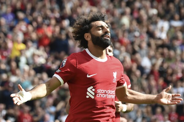 Liverpool's Mohamed Salah celebrates after scoring his sides second goal during the Premier League soccer match between Liverpool and AFC Bournemouth at Anfield, in Liverpool, England, Saturday, Aug. 19, 2023. (AP Photo/Rui Vieira)