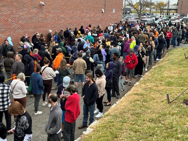 Several hundreds of voters waiting to vote outside the Douglas County Election Commission office on Nov. 4, 2024. (AP Photo/Margery Beck)