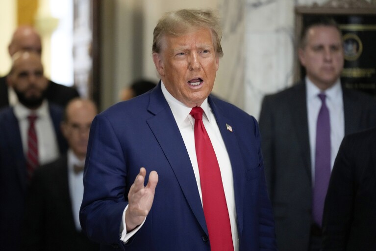 FILE - Former President Donald Trump speaks outside the New York Supreme Court, Jan. 11, 2024, in New York. The case that brings Trump to the U.S. Supreme Court to preserve his right to run again for the presidency began during the summer of 2020, when a bored law professor in Indiana began to research the history of two rarely noticed sentences tucked in the middle of the 14th Amendment. (AP Photo/Seth Wenig, File)