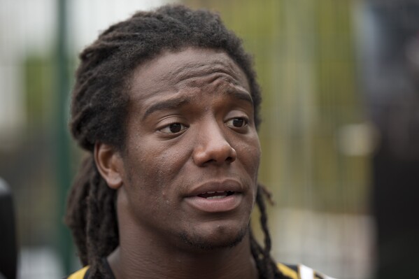 FILE - Jacksonville Jaguars safety Sergio Brown speaks during an NFL event for kids, July 15, 2015, in south London. The former NFL player has been arrested in southern California nearly a month after the body of his 73-year-old mother was found behind her suburban Chicago home. San Diego County Jail records show Wednesday, Oct. 11, 2023, that Brown, 35, was booked into the facility Tuesday afternoon, Oct. 10, following a “fugitive arrest.” (AP Photo/Matt Dunham, File)