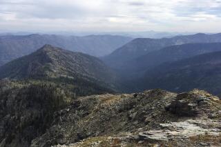 FILE - In this August 2016, file photo, is the view into the Bunker Creek drainage from the Swan Ridge Alpine Trail near Swan Lake, Montana. The U.S. Forest Service has given preliminary approval to a plan for road building, logging and other forest management on Forest Service land in Montana's Swan Valley. The agency says the goal is to reduce wildfire dangers and enhance habitat for federally protected species such as Canada lynx, bull trout and whitebark pine trees. (Sam Wilson/The Daily Inter Lake via AP, File)