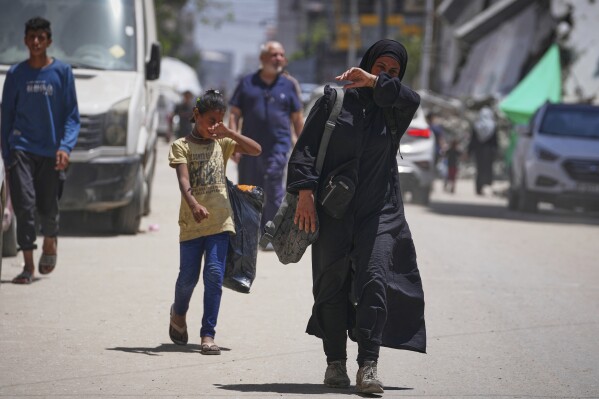 A family digs through trash for bits of food, showing Gaza's growing  desperation | AP News
