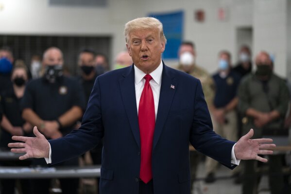 President Donald Trump speaks as he tours an emergency operations center and meets with law enforcement officers at Mary D. Bradford High School, Tuesday, Sept. 1, 2020, in Kenosha, Wis. (AP Photo/Evan Vucci)