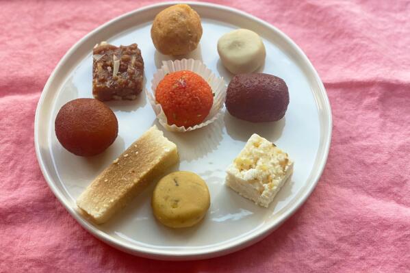 An assortment of sweets from an Indian food shop are displayed in New York on Oct. 19, 2022. These sweets are typically enjoyed on Diwali, the Hindu festival of lights. (Katie Workman via AP)