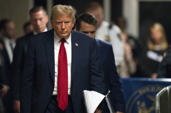 Former President Donald Trump walks over to addresses reporters following the day's proceedings in his trial at Manhattan criminal court in New York, Thursday, May 16, 2024. (Steven Hirsch/New York Post via AP, Pool)