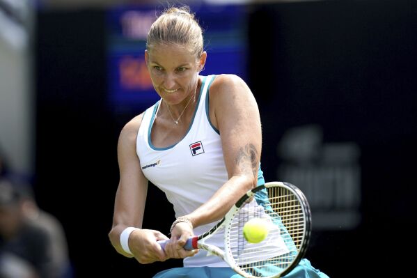 Czech Republic's Karolina Pliskova returns a shot to Belgian's Elise Merten, during a women's singles match, on day three of the Rothesay International Eastbourne tennis tournament, at Devonshire Park, in Eastbourne, England, Monday June 26, 2023. (John Walton/PA via AP)