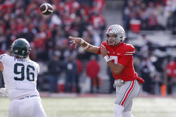Ohio State quarterback C.J. Stroud throws a pass against Michigan State during the first half of an NCAA college football game Saturday, Nov. 20, 2021, in Columbus, Ohio. (AP Photo/Jay LaPrete)