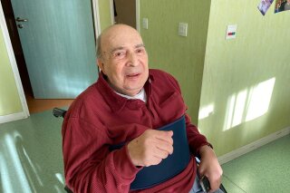 This photo dated March 15, 2020, shows Meyer Haiun in the Paris care home, la Residence Amaraggi, where the 85-year-old died 11 days later. Taken by his brother, Robert Haiun, this is the last photo the family has of Meyer. In France, a reckoning is beginning for 14,000 deaths in care homes, a cataclysm that scythed through the generation that endured World War II. Families whose elders died behind the closed doors of homes in lockdown are filing wrongful death lawsuits, triggering police investigations. (Courtesy of Robert Haiun via AP)