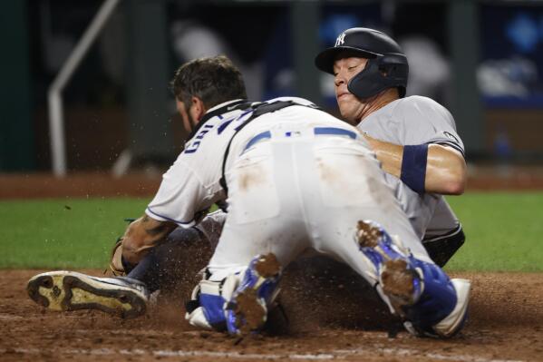 ST. PETERSBURG, FL - APRIL 09: Brett Gardner (11) of the Yankees hustles  over towards third base during the regular season game between the New York  Yankees and Tampa Bay Rays on