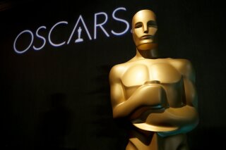 FILE - In this Feb. 4, 2019 file photo, an Oscar statue appears at the 91st Academy Awards Nominees Luncheon in Beverly Hills, Calif. An animated film about Grendel, a drama about a transgender woman and a documentary about a girl finding her birth parents in China are among the Student Academy Awards gold medal winners. The Academy of Motion Picture Arts and Sciences held the 46th edition of the event Thursday night, Oct. 17, 2019, in Beverly Hills. The awards spotlight emerging student filmmaking talent. Notable alumni include Pete Docter, Cary Fukunaga and Spike Lee. (Photo by Danny Moloshok/Invision/AP, File)