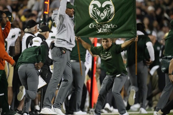 Colorado State head coach Jay Norvell, front left, jumps while calling plays in the first half of an NCAA college football game against Colorado, Saturday, Sept. 16, 2023, in Boulder, Colo. (AP Photo/David Zalubowski)