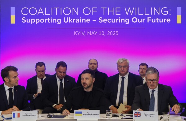 France's President Emmanuel Macron, left, Ukrainian President Volodymyr Zelenskyy and British Prime Minister Keir Starmer, right, sit during a summit at the Mariinskyi Palace, in Kyiv, Ukraine, Saturday, May 10, 2025. (Ludovic Marin, Pool Photo via AP)