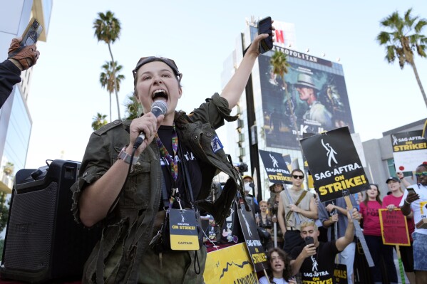 SAG-AFTRA captain Mary M. Flynn rallies fellow striking actors on a picket line outside Netflix studios, Wednesday, Nov. 8, 2023, in Los Angeles. (AP Photo/Chris Pizzello)