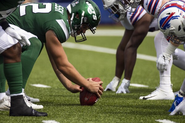 FILE - New York Jets long snapper Thomas Hennessy (42) readies the snap during the first quarter of an NFL football game against the Buffalo Bills, Sunday, Sept. 13, 2020, in Orchard Park, N.Y. (AP Photo/Brett Carlsen, File)