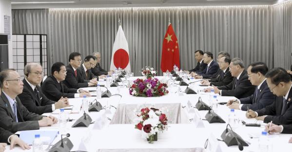Japanese Prime Minister Fumio Kishida, third left, holds a meeting with Chinese Premier Li Qiang, third right, in Seoul, South Korea, Sunday, May 26, 2024. (Daisuke Suzuki/Kyodo News via AP)